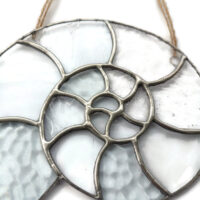 Ammonite stained glass light catcher in textured clear glass