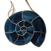 Ammonite stained glass light catcher in streaky blue glass
